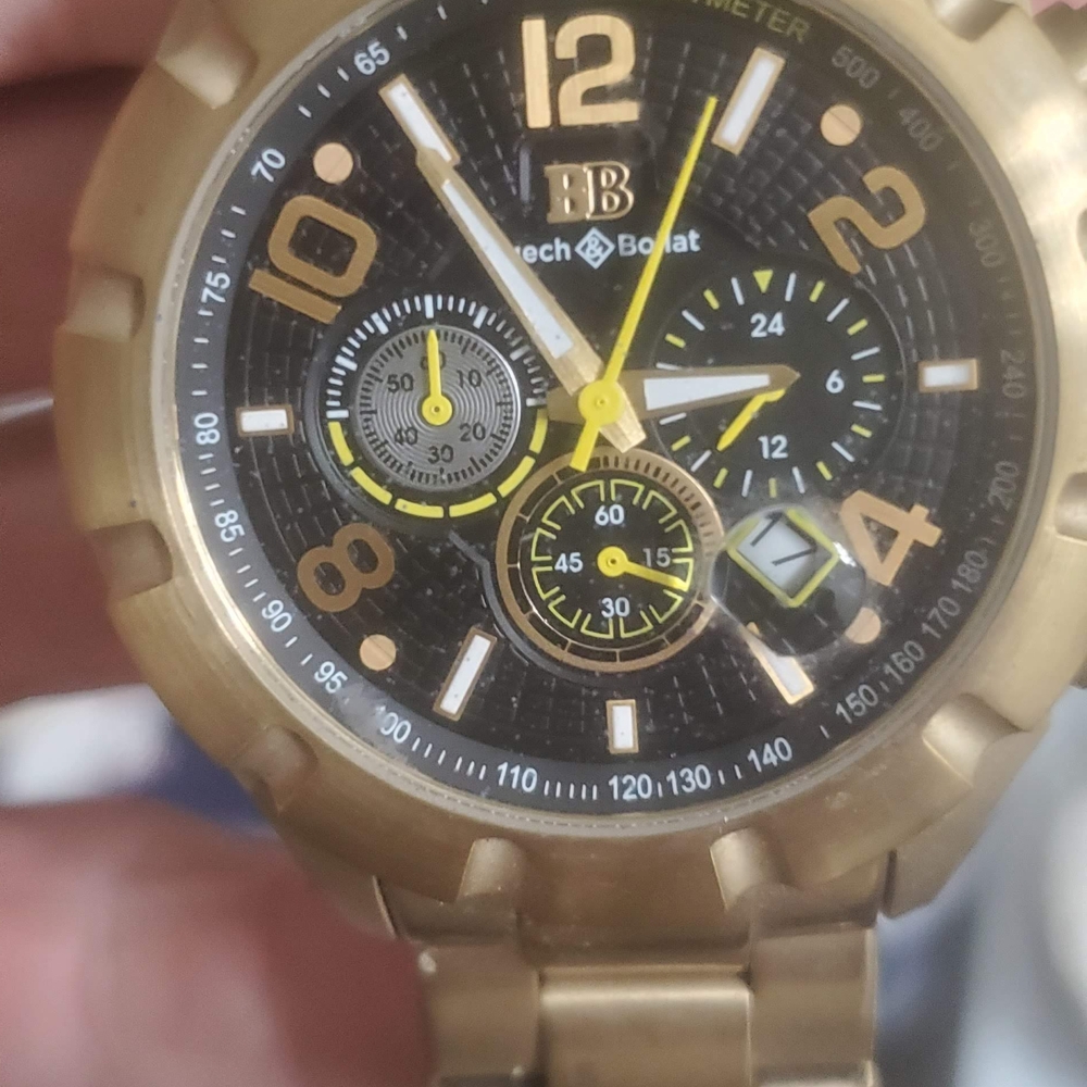 Gold and Black Chronograph Watch with Luminous Hands